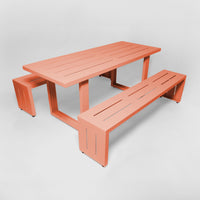 A salmon pink S.R. All Aluminum Table Set on a white background