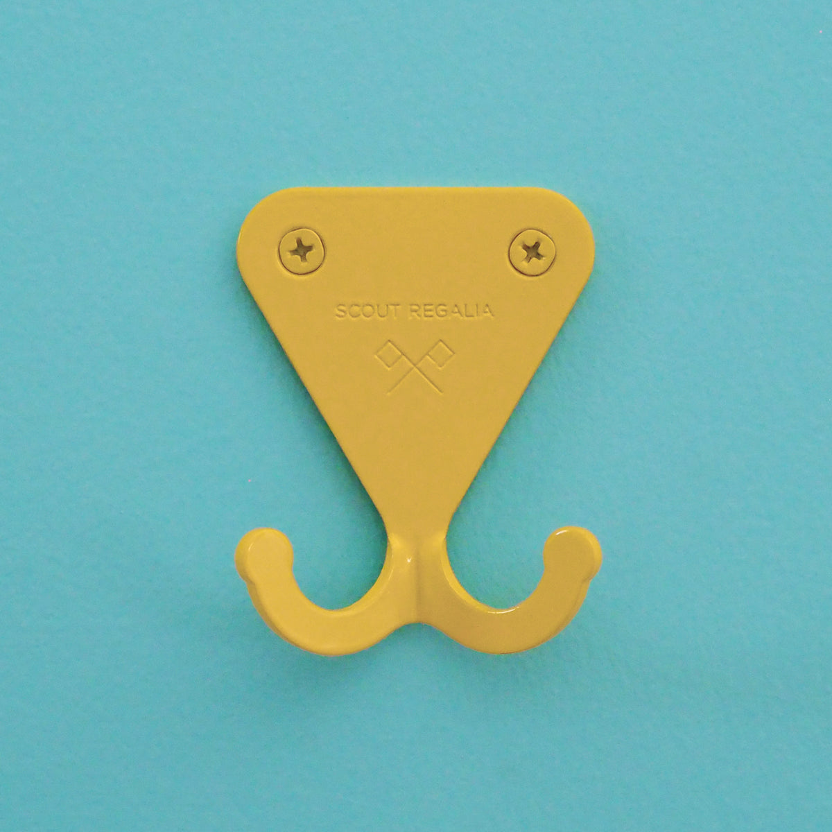 Citrus Yellow S.R. Wall Hook on turquoise wall