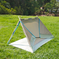 S.R. Lean To Tent Open backside view on grass with trees in background.