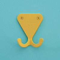 Citrus Yellow S.R. Wall Hook on turquoise wall