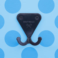 Navy Grey S.R. Wall Hook on light blue background with darker blue polka dots.